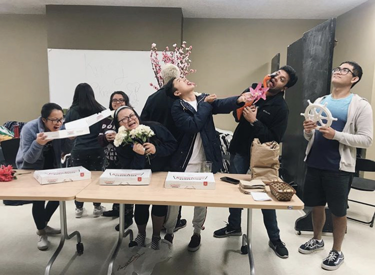 Students posing with donuts