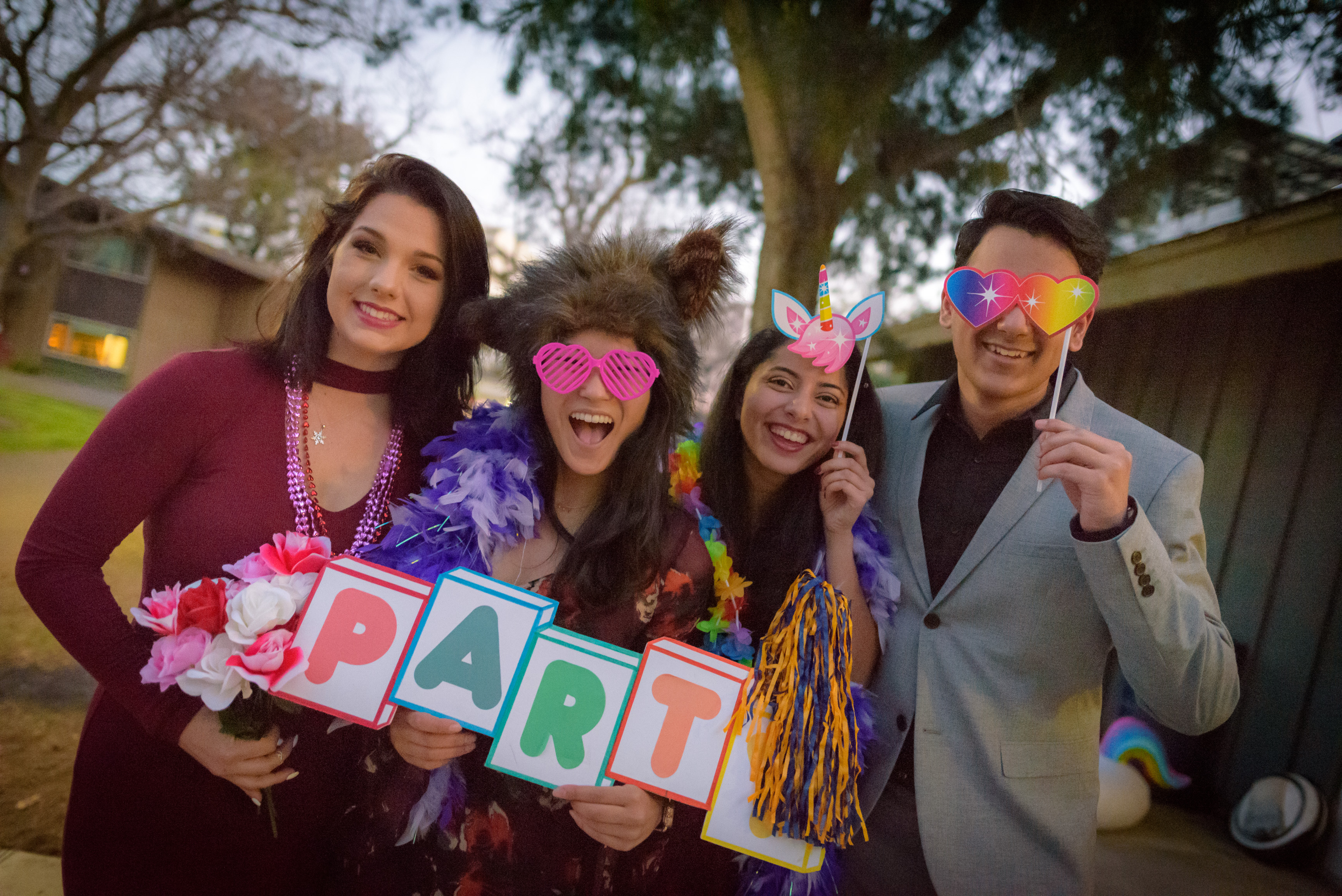 Students dressed up and posing with props