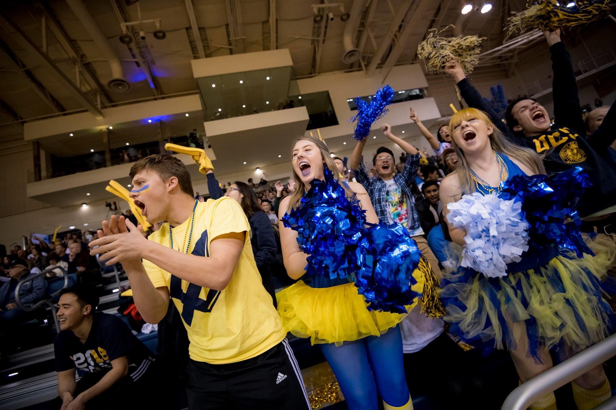 Spirited Students Cheering at Basketball Game